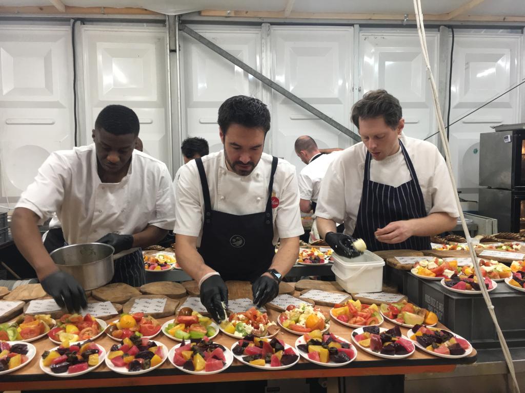 Gregory and two chefs plating dishes for Sissi Fabulous Food.