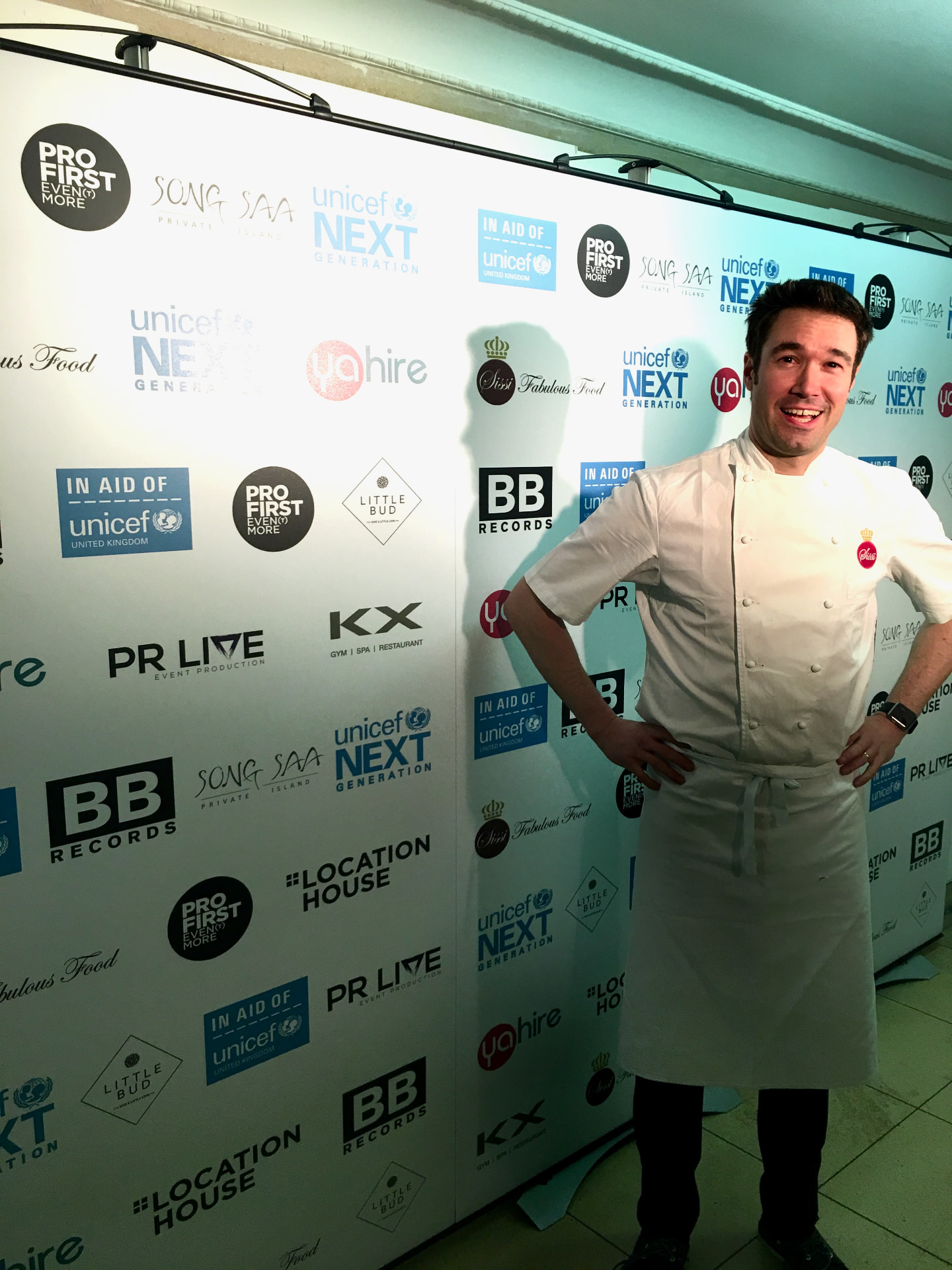 Gregory in chef whites at a branded event.