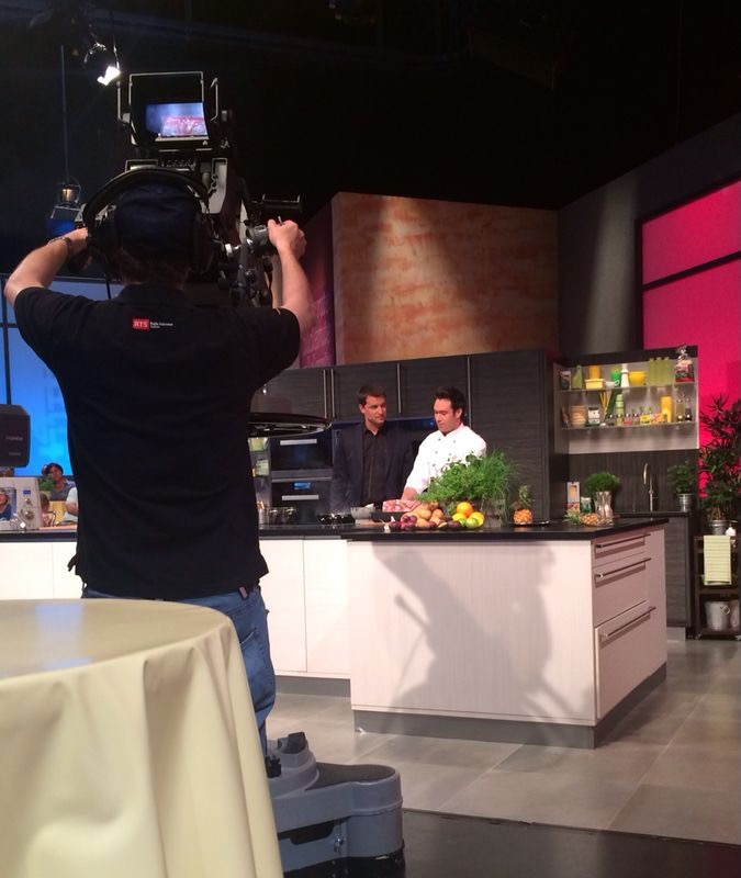 A camera operator filming Gregory on the Al Dente set.