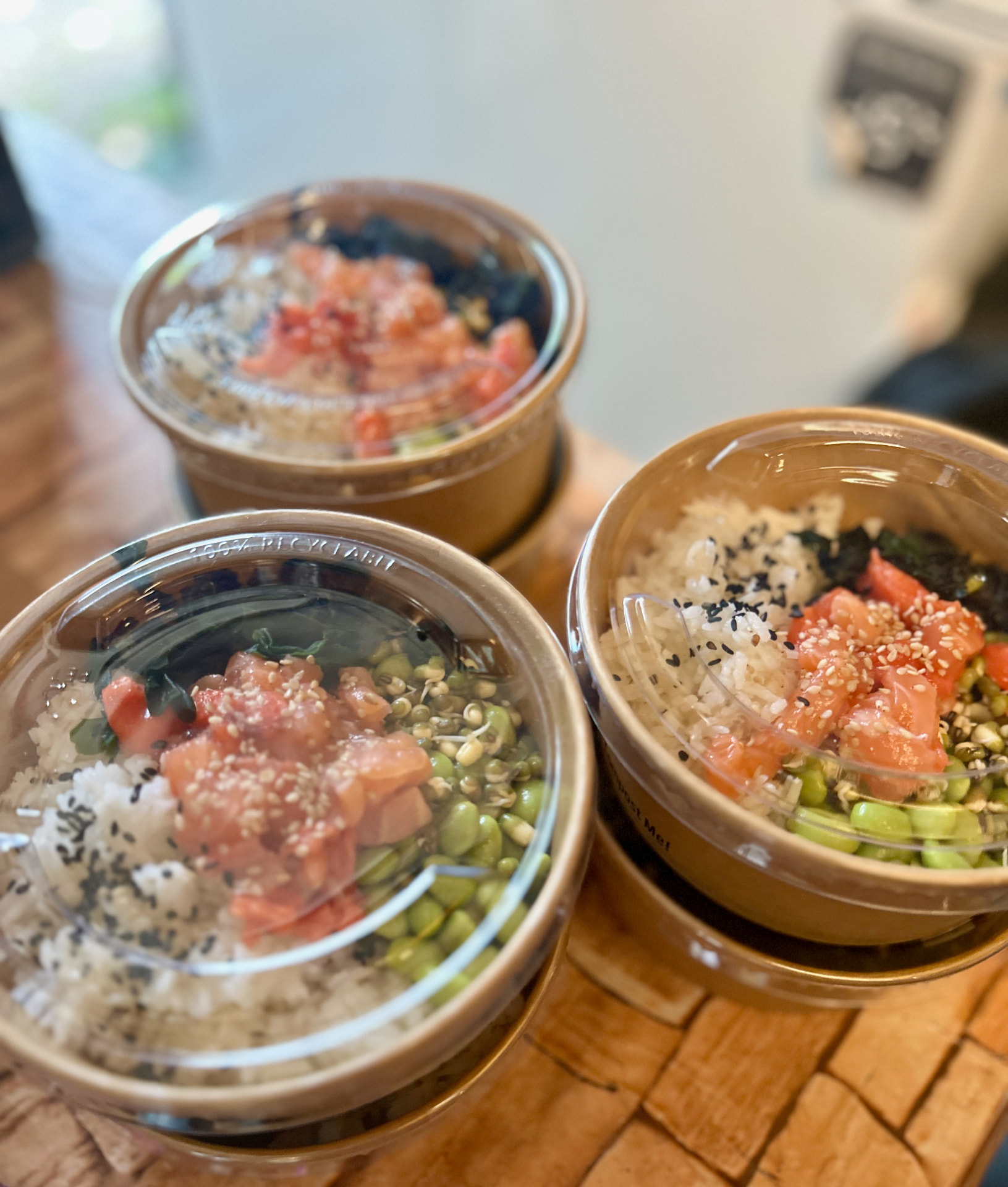Fresh poke bowls prepared for Clean Junk Food Co. service.